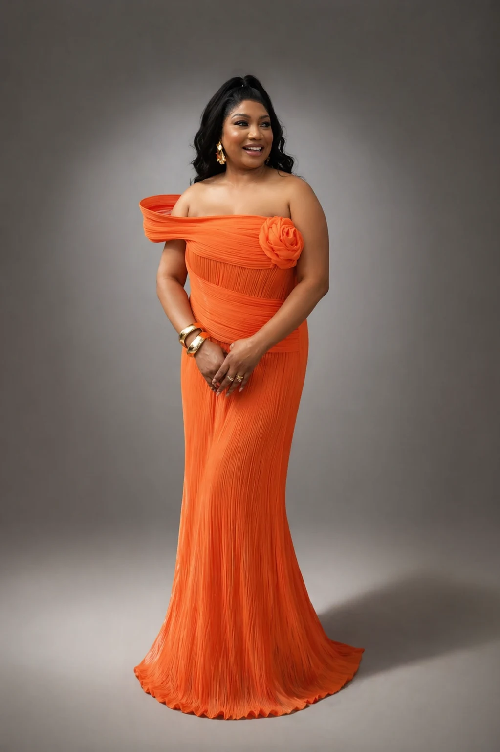 Tangerine Rose Zigham orange pleated evening gown worn by model