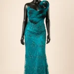 Teal Spiral Zigham gown, front mannequin view with looped shoulder sculpture